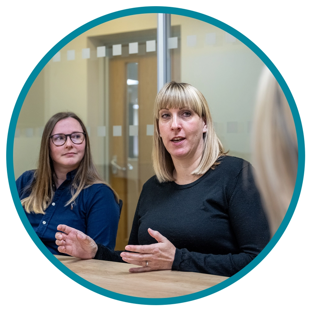 query handling service- staff in a meeting