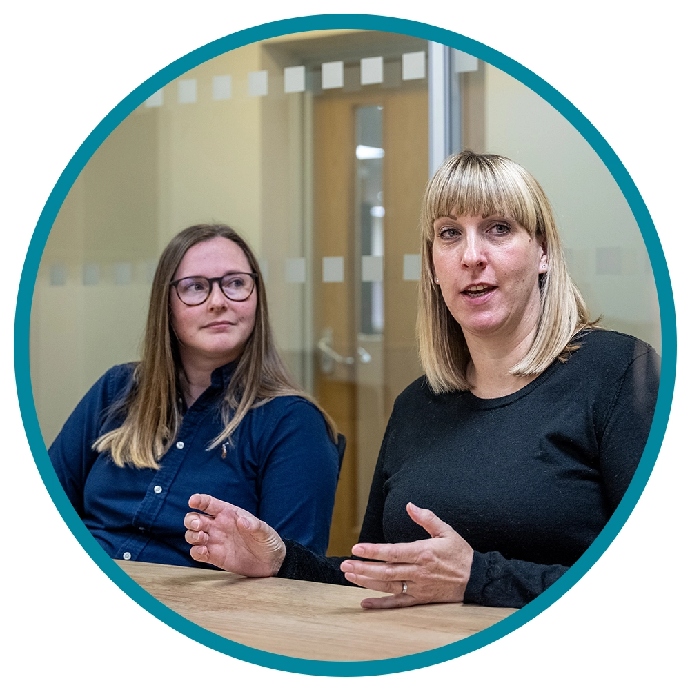 Multi-channel customer support- two staff members in a meeting